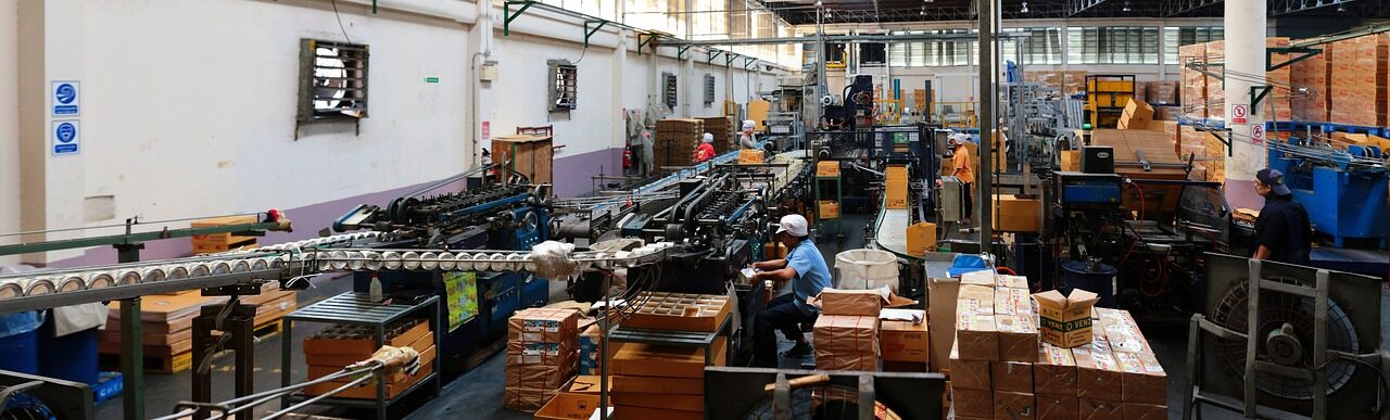 Factory worker operating industrial machinery