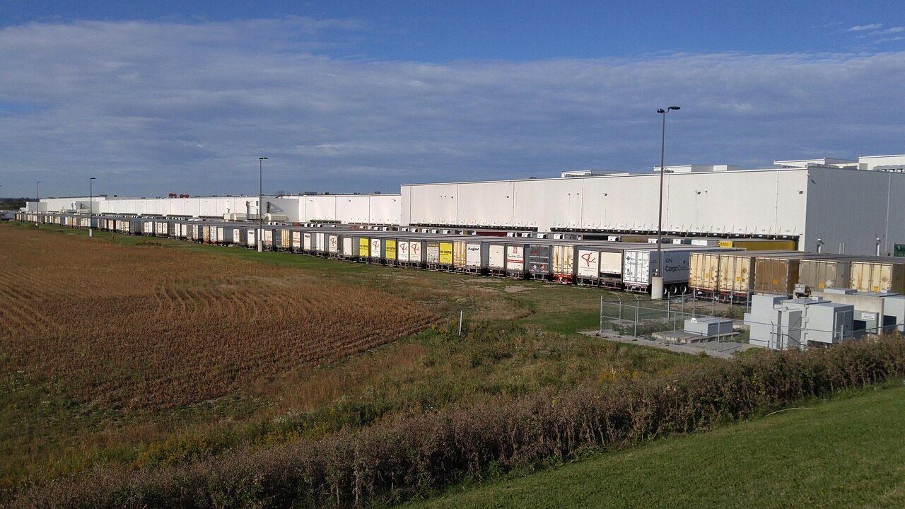 Distribution trucks in depot staging area